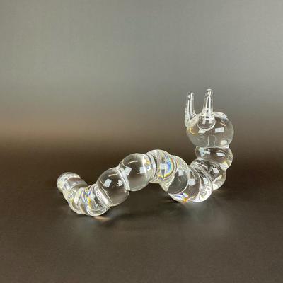 Sale Photo Thumbnail #23: Peter Yenawine ( American , b. 1944 ) for Steuben glass caterpillar sculpture, designed in 1970, signed “Steuben” to underside at end of tail. Provenance from a 177 75th Street Collection.
Measurements:
10” in length, 6.5” in height, 2.5” in wid