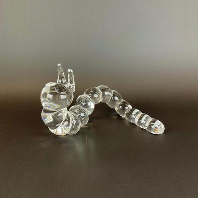 Sale Photo Thumbnail #21: Peter Yenawine ( American , b. 1944 ) for Steuben glass caterpillar sculpture, designed in 1970, signed “Steuben” to underside at end of tail. Provenance from a 177 75th Street Collection.
Measurements:
10” in length, 6.5” in height, 2.5” in wid