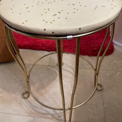 Small vanity stool and red rug