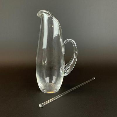 Sale Photo Thumbnail #913: designed by Lloyd Atkins model # 8077 comes with split handle includes stir stick. Pitcher does have scratches at bottom, please refer to photos.
Measurements:
10” in height, 3.5” in diameter
Handle sticks out 1.75”