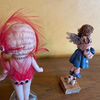 Pink mini glasses, mini books and two girl figures