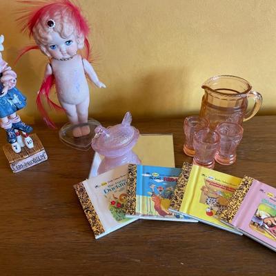 Pink mini glasses, mini books and two girl figures