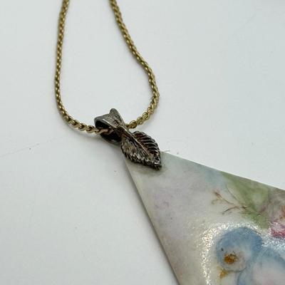 LOT 82: Clay Floral Pin & Pendant, Sarah Coventry Apple Pin, JJ Sailboat Brooch & More