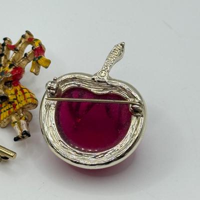 LOT 82: Clay Floral Pin & Pendant, Sarah Coventry Apple Pin, JJ Sailboat Brooch & More