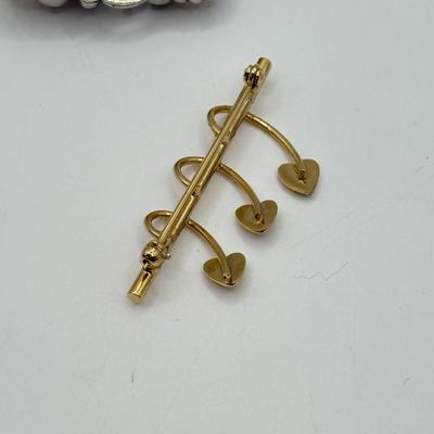 LOT 82: Clay Floral Pin & Pendant, Sarah Coventry Apple Pin, JJ Sailboat Brooch & More