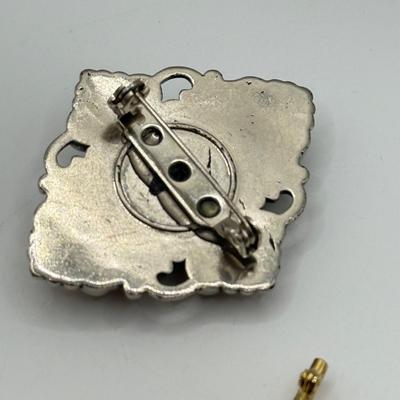 LOT 82: Clay Floral Pin & Pendant, Sarah Coventry Apple Pin, JJ Sailboat Brooch & More