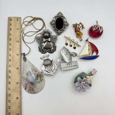 LOT 82: Clay Floral Pin & Pendant, Sarah Coventry Apple Pin, JJ Sailboat Brooch & More