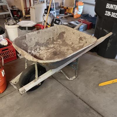 PAIR OF FOLDING METAL ADJUSTABLE HEIGHT SAW HORSES AND A WHEEL BARROW
