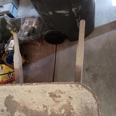 PAIR OF FOLDING METAL ADJUSTABLE HEIGHT SAW HORSES AND A WHEEL BARROW