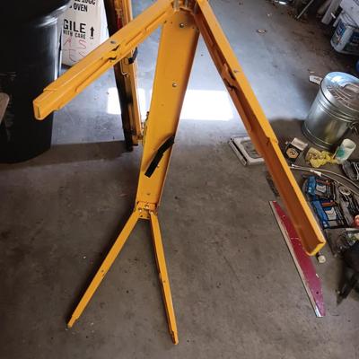 PAIR OF FOLDING METAL ADJUSTABLE HEIGHT SAW HORSES AND A WHEEL BARROW