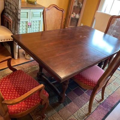 Dark table with wicker back chairs