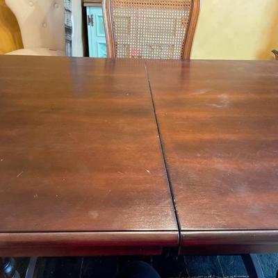 Dark table with wicker back chairs