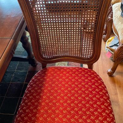 Dark table with wicker back chairs