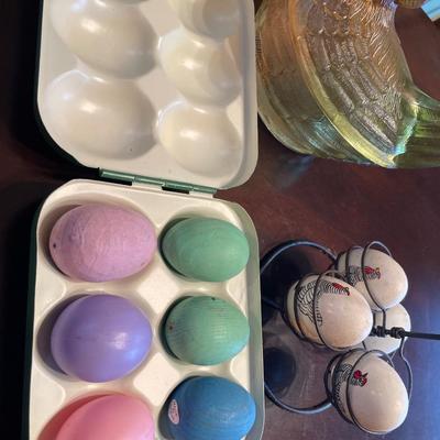 Glass hen on a nest with eggs and metal egg holder