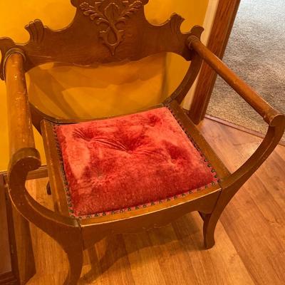 Unique Antique chair with red tuft seat