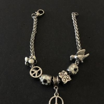 Super cute very nice free bird + peace charm bracelet. Very nice quality.