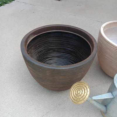 2 LARGER PLASTIC FLOWER POTS AND A WATERING CAN