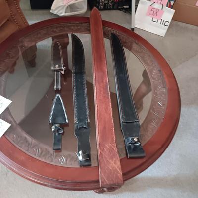 A VARIETY OF LEATHER SHEATHS