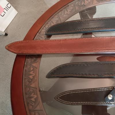 A VARIETY OF LEATHER SHEATHS