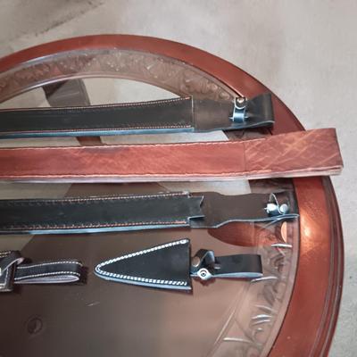 A VARIETY OF LEATHER SHEATHS