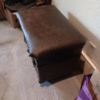 CUSHIONED TOP SMALLER TRUNK AND A RUSTIC CROSS
