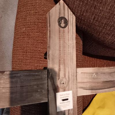 CUSHIONED TOP SMALLER TRUNK AND A RUSTIC CROSS