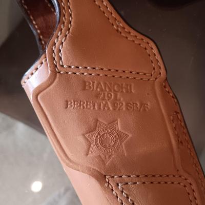 LEATHER HOLSTER AND HATCHET TYPE TOOL