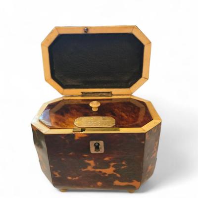 Sale Photo Thumbnail #45: 19th C. English Regency tea caddy on four bun feet. Working key and lock. Inscription of later date on inset lid. 
4.5 x 3.2d x 4.6 high