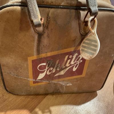 Schlitz airplane, bowling bag and paper ad