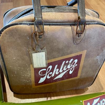 Schlitz airplane, bowling bag and paper ad