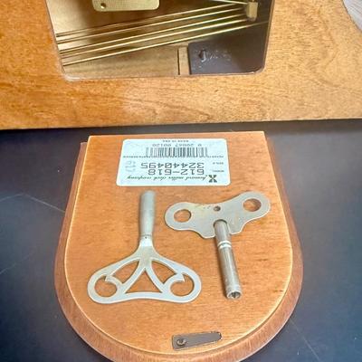 Sale Photo Thumbnail #214: Wood case, includes 2 keys.  Model 612-618. Clock runs as expected, but chimes don't play.  Mechanism may need some adjustment, seems like the chime feature is fully wound but the on-off switch does not seem to work as expected.
