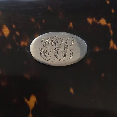 Sale Photo Thumbnail #52: Rectangualr scnt box. Lined blue velvt. 3 Cut crystal bottles. Monogrammed silver medallion on domed lid.
6.75 x 3.25 x 4.5h