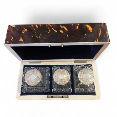Sale Photo Thumbnail #50: Rectangualr scnt box. Lined blue velvt. 3 Cut crystal bottles. Monogrammed silver medallion on domed lid.
6.75 x 3.25 x 4.5h