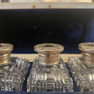 Sale Photo Thumbnail #51: Rectangualr scnt box. Lined blue velvt. 3 Cut crystal bottles. Monogrammed silver medallion on domed lid.
6.75 x 3.25 x 4.5h