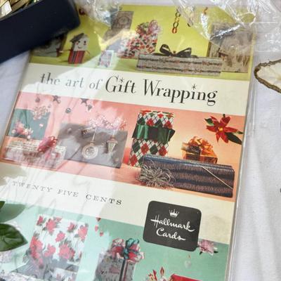 Fancy storage boxes, fancy scapbook paper pads, flowers and gold trims