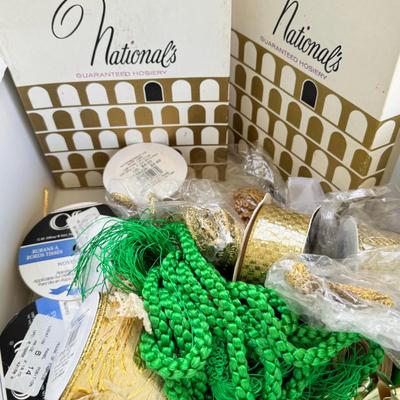 Fancy storage boxes, fancy scapbook paper pads, flowers and gold trims