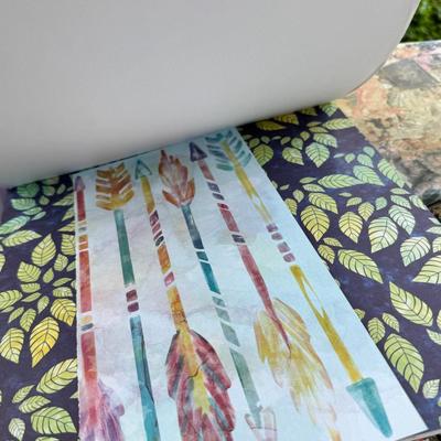 Fancy storage boxes, fancy scapbook paper pads, flowers and gold trims