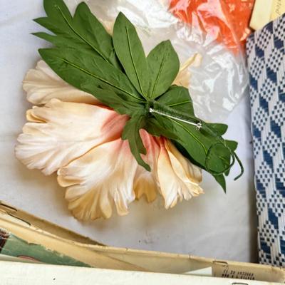 Fancy storage boxes, fancy scapbook paper pads, flowers and gold trims