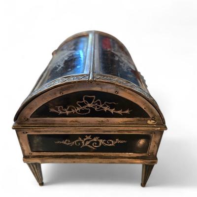 Sale Photo Thumbnail #57: 19th C. English tortoise and silver inlay jewelry case. Hallmarks. Two sided domed top with foliate silver edging and reeded legs. 
6.5 x 4.5 x 5