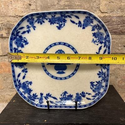 Sale Photo Thumbnail #290: Large blue and white oval stoneware platter, vintage Delft square plate with small fault, and amber and gold Bohemian bowl with wonderful bird motif