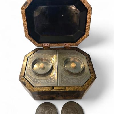Sale Photo Thumbnail #88: Excellent tea caddy with all imserts and lids intact.
Hand-crafted in China for the European market, this English black lacquered octagonal hinged tea caddy features a decorative stenciled motif of pagodas and foliage in gilt, which contrasts beautifully 