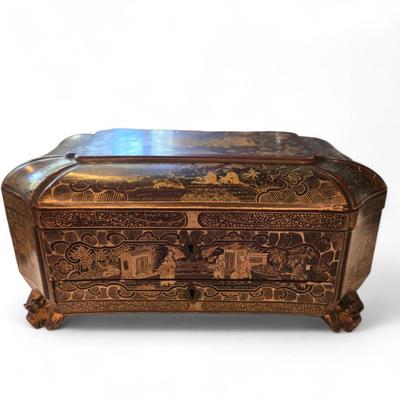 Sale Photo Thumbnail #93: Lovely lacquered sewing box with single drawer on dragon head feet. 
19th century Chinese lacquer sewing box from the Qing Dynasty. Decorated all over beautifully with intricate designs and images of ancient Chinese people and structures. No additional in