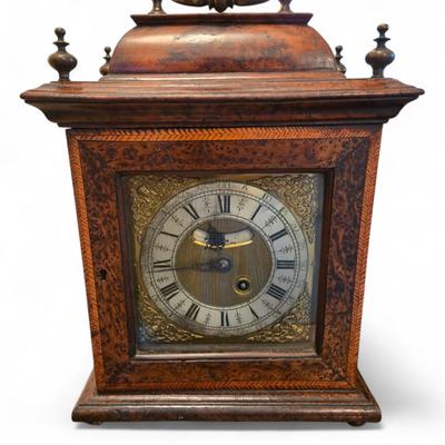 Sale Photo Thumbnail #101: Fine example of 18th C. George II bracket mantle clock with burl and fruitwood inlays. Signed John Smallwood Macclesfield. Keyed doors at front and back display face and engraved and chased works. Handle at top. Face and back interiors are framed by ornat