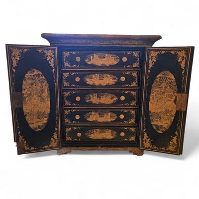 Sale Photo Thumbnail #104: Export small chest Chinois lacquer. two doors open to reveal 5 drawers with carvd button pulls.
some crackleture on top and back. 
15.75 x 8 x 14"