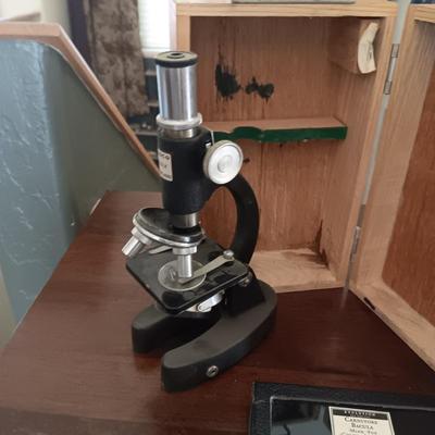 CARNIVORE BACULA AND A STUDENT'S TASCO 600X MICROSCOPE IN WOODEN CASE