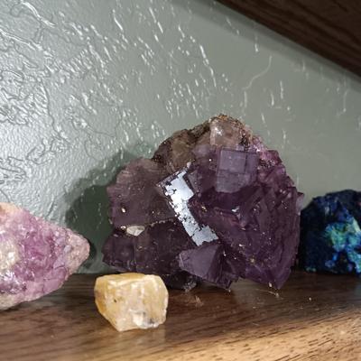 ROCKS FROM A COLLECTION LABELED FLUORITE AND PUMICE