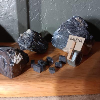 ROCKS FROM A COLLECTION LABELED GALENA, OIL SHALE & PETRIFIED WOOD