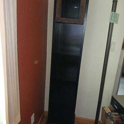 NARROW SHELF WITH PICTURE FRAME ON THE TOP
