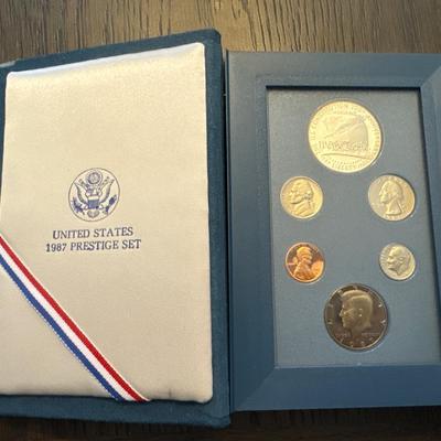 Sale Photo Thumbnail #33: Includes box, book, COA, 6 coins encased. 
Lincoln cent 
Jefferson nickel 
Roosevelt dime
Washington quarter 
Kennedy half dollar 
Constitution Proof (90% Silver - 26.730 grams)