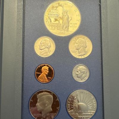 Sale Photo Thumbnail #43: Includes box, book, 7 coins, spec sheet. 
Coins include: 
Lincoln Penny 
Jefferson nickel 
Roosevelt dime 
Washington quarter 
Kennedy half 
Liberty half dollar 
Liberty silver dollar (90% Silver) 
All minted in San Francisco